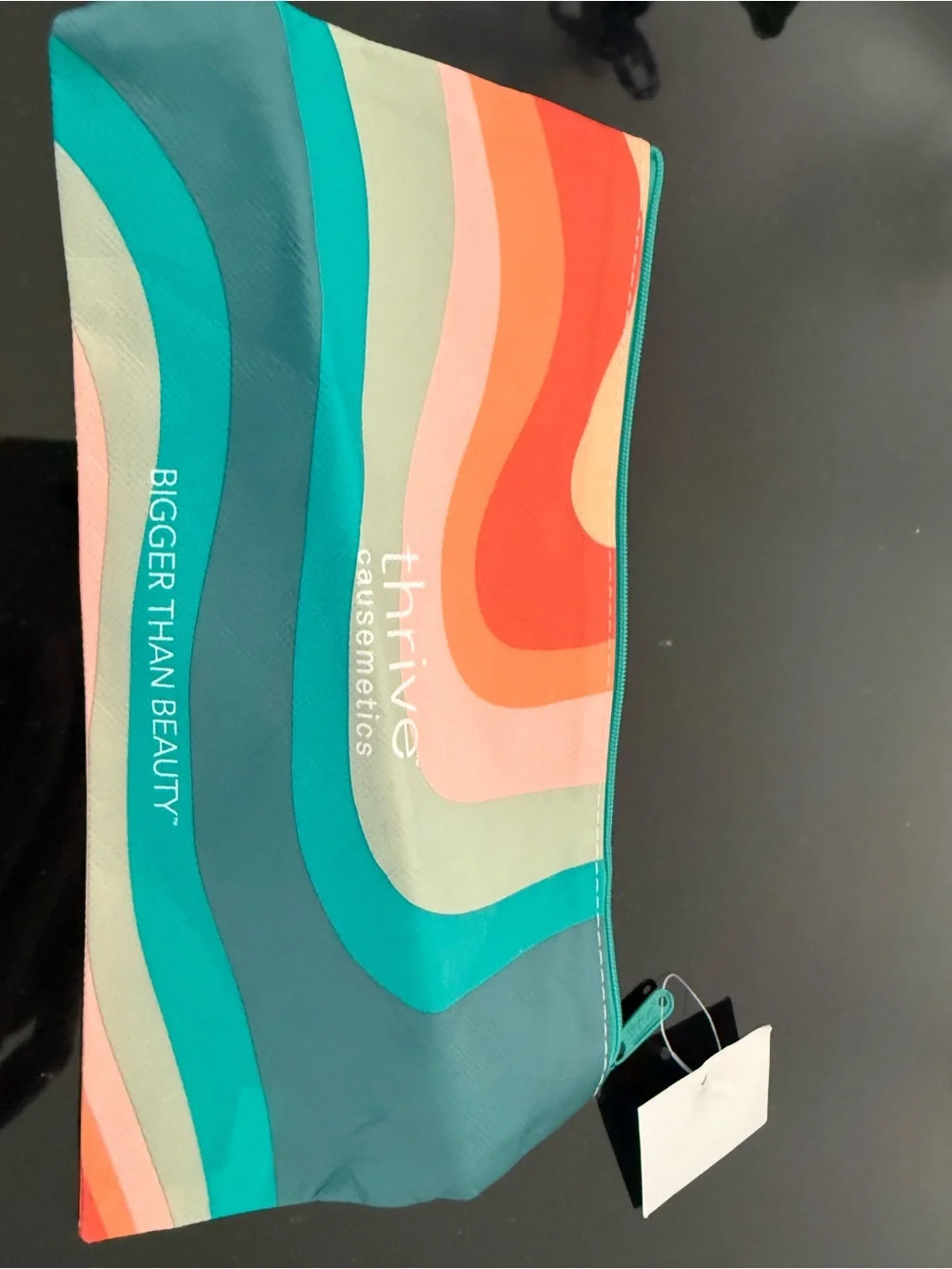 thrive causemetics teal, aqua, coral, peach striped cosmetic bag